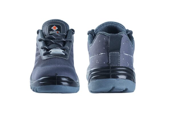 A pair of Blaze Safety shoe in gray color seems to hiking shoes from Agarson safety shoe are displayed against a white background. The shoes feature a mesh upper, sturdy rubber soles with deep treads for grip, and black laces. The brand logo is visible on the tongue of the shoe in the foreground.