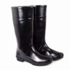 A pair of ceaser safety gumboot, Shiny black agarsongumboots with a sleek design, featuring a slightly ridged sole and mid-calf height. The boots are standing upright side by side on a white background.