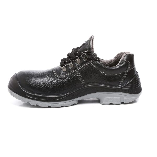 A single piece of black Duster Safety Shoe, rugged work shoes with a sturdy design and grey soles. These Agarsonshoes feature a reinforced toe, padded collars, metal eyelets, and lace-up closures, providing both comfort and durability. Brand tags are visible on the tongue and side, embodying reliable safetyshoes excellence.