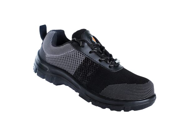 A Single shoe of black and dark grey Agarson hyryder safety shoe with mesh detailing. The shoes have thick, black rubber soles, lace-up closures, pull tabs on the heels, and a small logo visible on the tongues featuring an orange and black design. These safety shoes are positioned side by side.