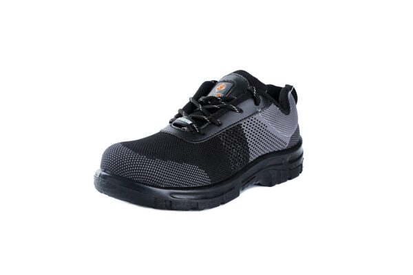 A Single shoe of black and dark grey Agarson hyryder safety shoe with mesh detailing. The shoes have thick, black rubber soles, lace-up closures, pull tabs on the heels, and a small logo visible on the tongues featuring an orange and black design. These safety shoes are positioned side by side.