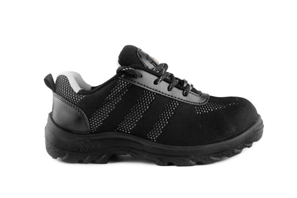 A black athletic Nexon Safety Footwear from Agarson Safety Shoe with a knit mesh upper and synthetic overlays, featuring a lace-up design and a cushioned sole with a rugged tread pattern. The interior has a gray fabric lining, and there are small reflective details near the heel and sides.