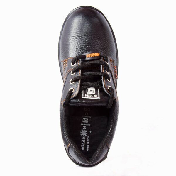 A single shoe of Sonet safety footwear in black, Work shoes from Agarson safety shoe with sturdy soles, black laces, orange stitching, and branded labels on the side. These safety shoes have a textured leather finish and are designed for heavy-duty use.