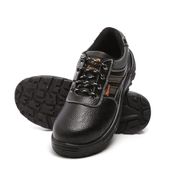 A pair of Sporty Safety Footwear in black, heavy-duty Agarson safety shoes with orange accents and robust laces. The shoes have a textured leather-like surface, reinforced toe caps, and thick, slip-resistant soles designed for durability and safety in demanding environments.