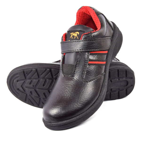 A pair of black leather shoes with red accents, featuring sturdy soles and a hook-and-loop strap closure, perfect as safety shoes for women seeking both style and protection.